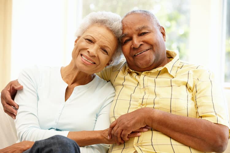 A senior couple happy and healthy in their home.
