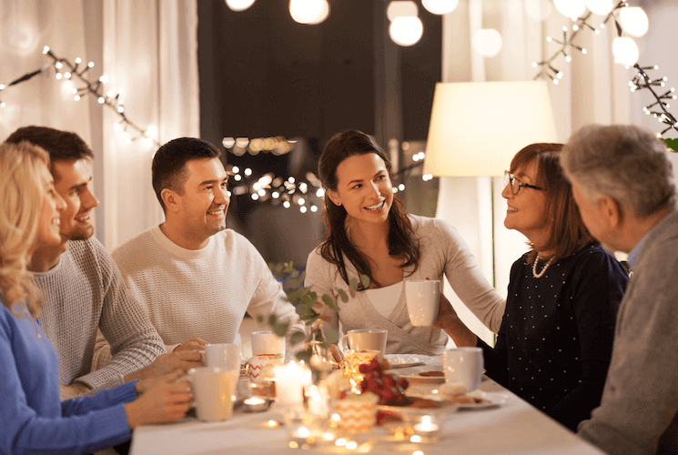 Family gathered at a table after a holiday meal.