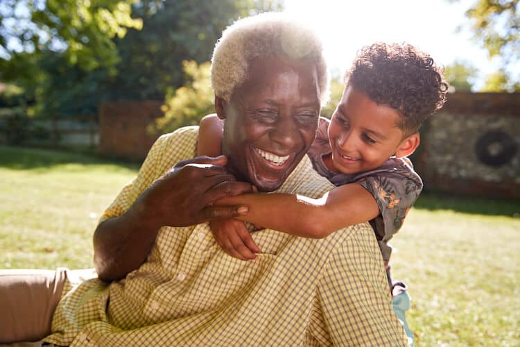Senior man enjoying time outdoors with his grandson.