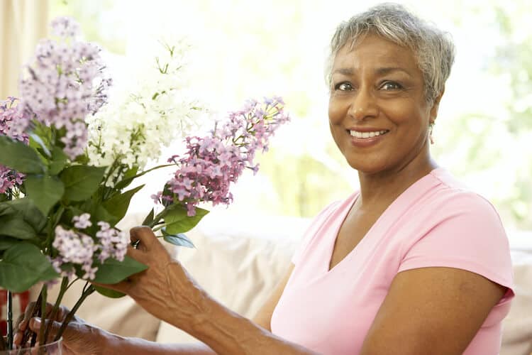 Woman celebrating her senior independence at home.