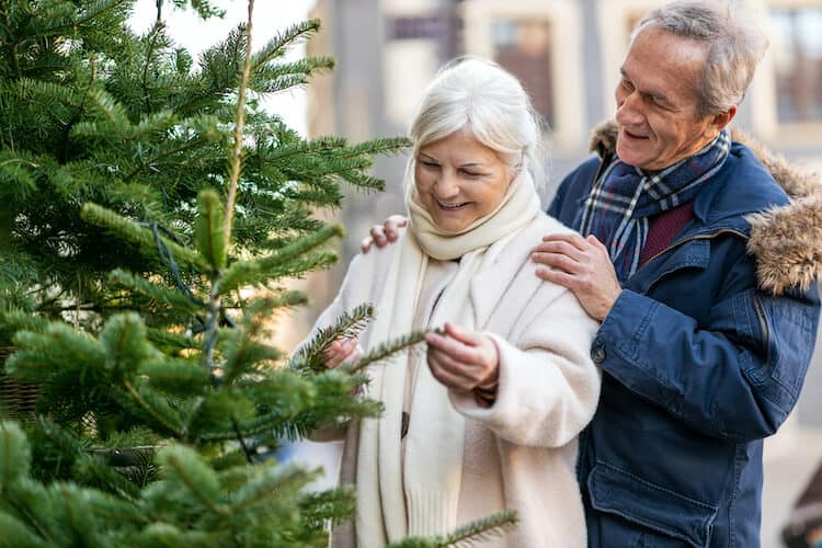 Senior couple buying a Christmas tree in Denville.