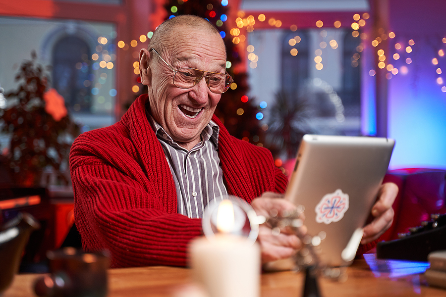 Senior man participating in festive holiday trivia