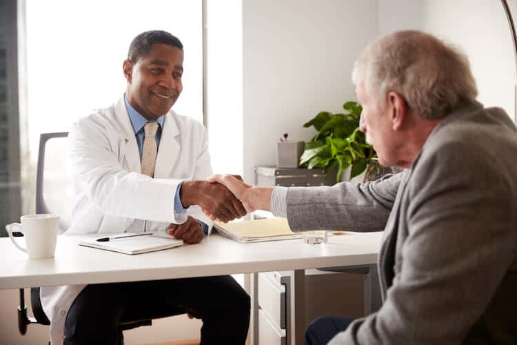 Senior man having consultation with doctor.